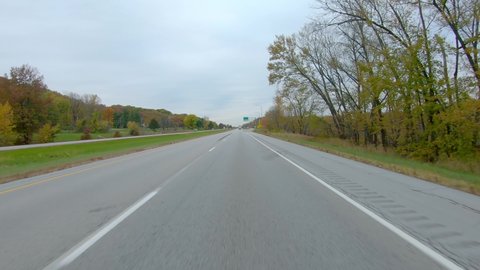 POV while driving on Interstate I280 near the exchange for the Weigh Station in late Fall on a cloudy day near Moline Illinois