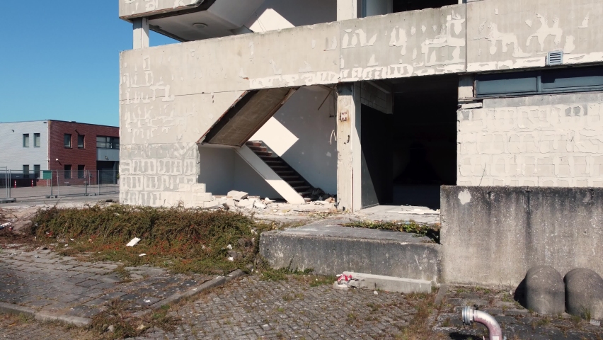 Half demolished building open constuction, aerial along stairways upwards
