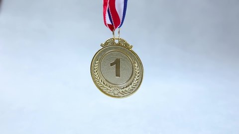 Winner or champion gold trophy medal on concrete stone grey background. Victory first place of competition. Winning or success concept.
