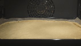 4K Time Lapse of baking process of tasty pie in oven, homemade. Time-lapse video of sweet pie baked in oven.