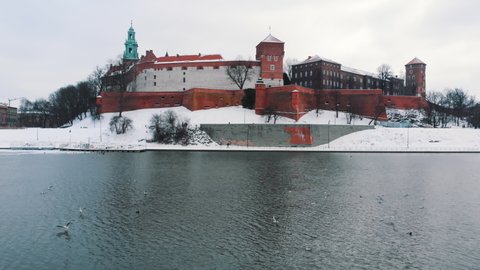 Slow-motion footage of Wawel Royal Castle located in central Krakow, Poland considered the most historically and culturally significant site in the country. Vistula River with seagulls in the
