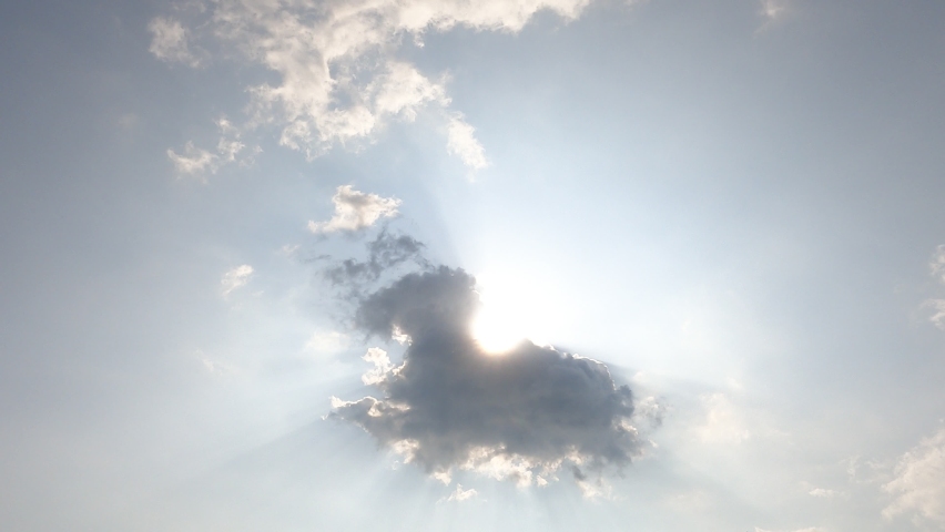 Bright sun light ray flare n bokeh sunbeam shined through white cumulus cloud n cirrocumulus cloudscape on beautiful sunny clear blue sky background in summer sunlight, 4k cinemagraph b-roll TimeLapse Royalty-Free Stock Footage #1071762850