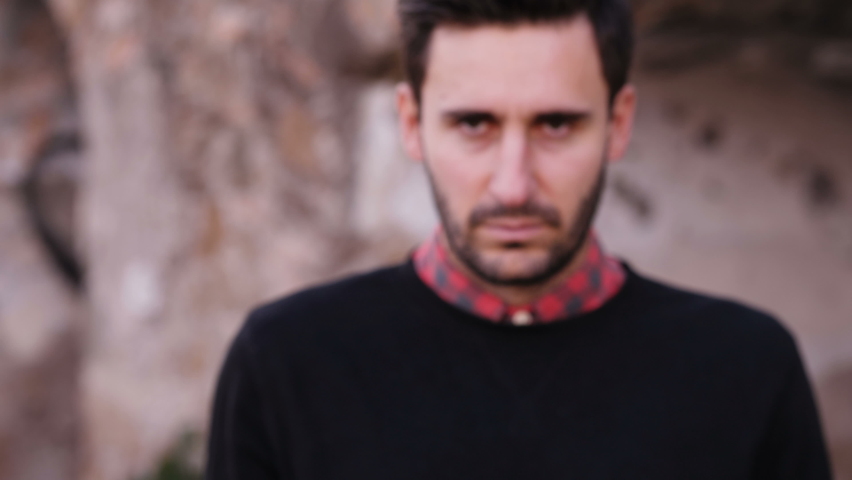 reject, denial - serious man prohibits the camera from approaching