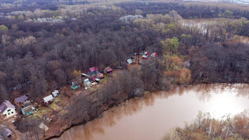 Suburban zone in the flood season. Houses stand at the water