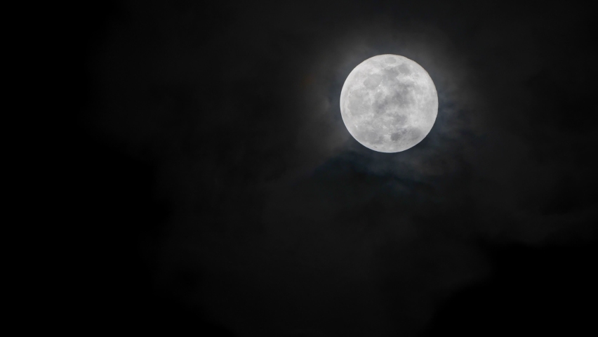 Full glowing moon with clouds being blown by winds at nights | Shutterstock HD Video #1071772636