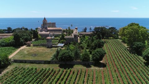 Aerial view of the gardens the church and monastery of the Lerins abbey located at Ile Saint Honorat island is the second largest of the Lerins-islands near the French Riviera town of Cannes 4k
