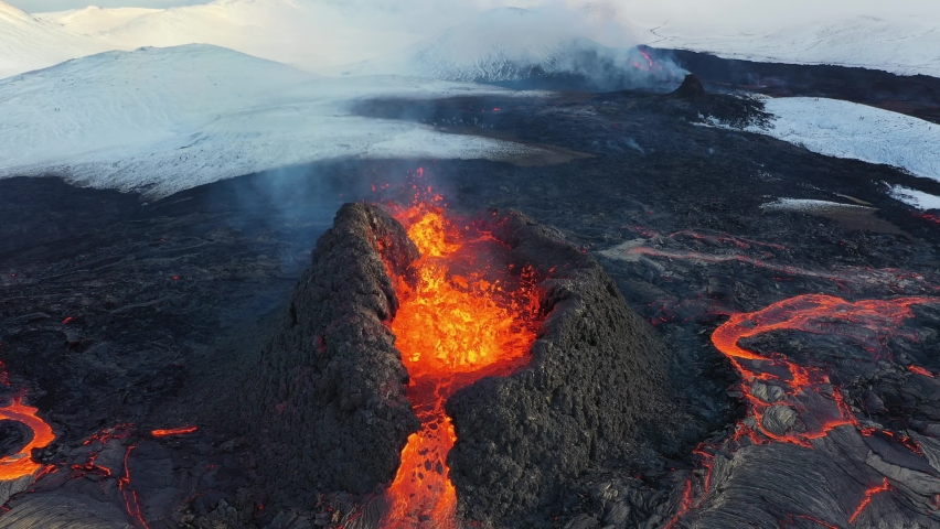 4K Drone aerial video of Iceland Volcanic eruption 2021. The volcano Fagradalsfjall is located in the valley Geldingadalir close to Grindavik and Reykjavik. Hot lava and magma coming out of the crater | Shutterstock HD Video #1071774052
