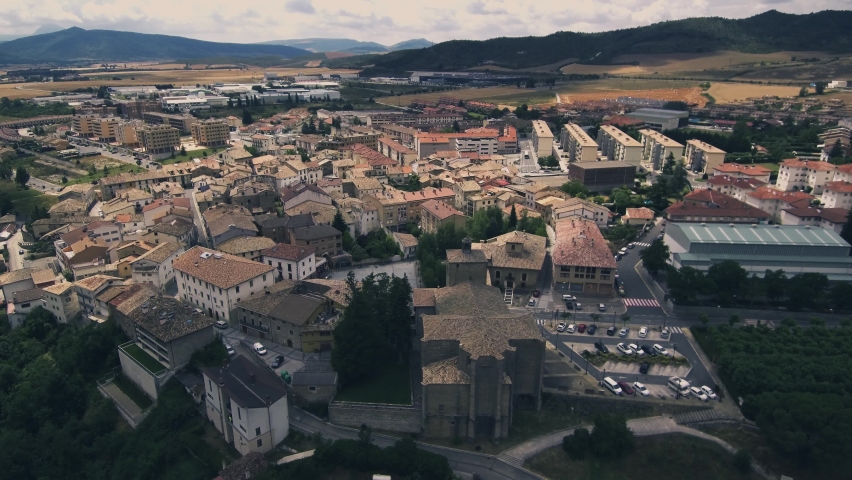 Anaerial shot of old buildings near an old bridge in Navarra, Spain in 4K