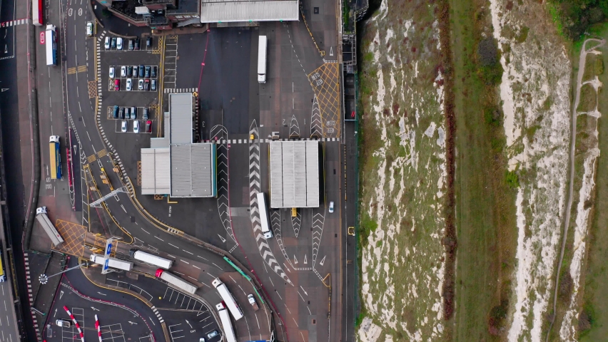 Top down Aerial shot of trucks queueing to leave the UK at dover to calais harbour brexit | Shutterstock HD Video #1071798913