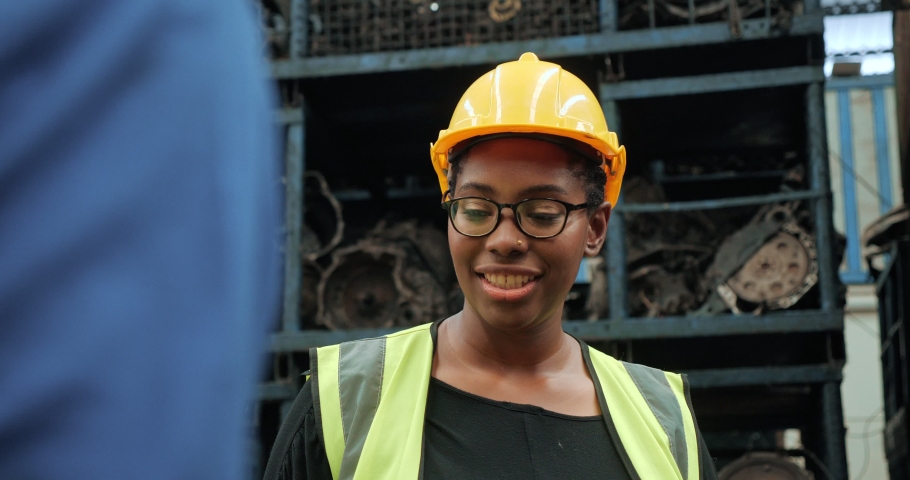 Close up of black women worker happiness in factory and engineering team, Team of factory workers celebrate a great success by putting hands together. Royalty-Free Stock Footage #1071803122