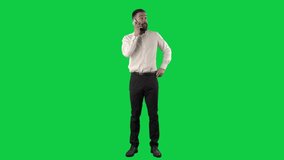 Bored and tired business man having cell phone call from work yawning. Full length on green screen chroma key background. - Powered by Shutterstock - Get 15% off with code: PIKWIZARD15