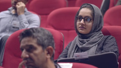 Young Muslim female jury expert at the startup business pitch session. Karachi, Pakistan. 15th Dec 2018