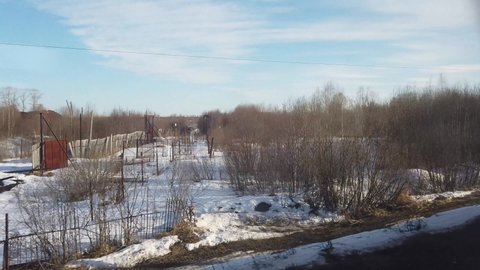 view from the window of a railway train at the abandoned GULAG colony in the village of Burepolom and Sherstki in April 2021