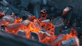 Burning coal glowing red and flaming embers, grill concept. Slow motion. - Powered by Shutterstock - Get 15% off with code: PIKWIZARD15
