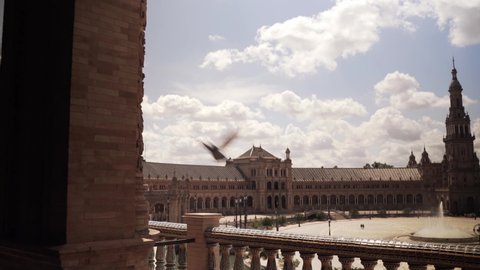 Seville, Spain - April 22, 2021: View of Spain square (plaza de España) from one of its balconies on a sunny day. Travelling -tilt down
