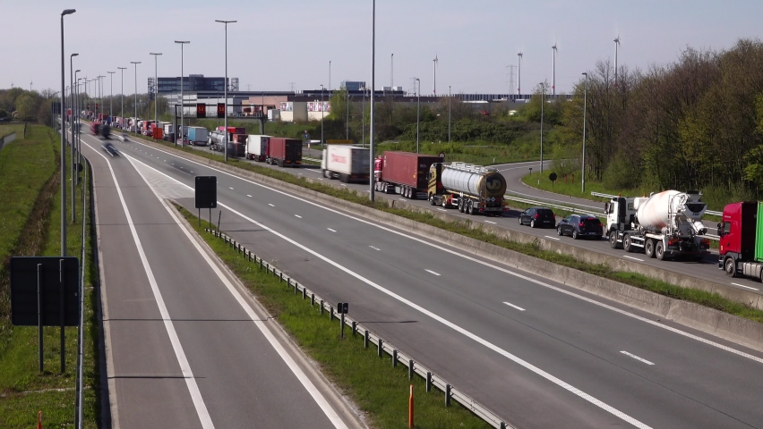 Westerlo, Antwerp Belgium - May 4 2021: Smooth quick motion video with over 1500 long exposure photos of the busy rush hour traffic at a bottleneck through road works on this highway E313.
