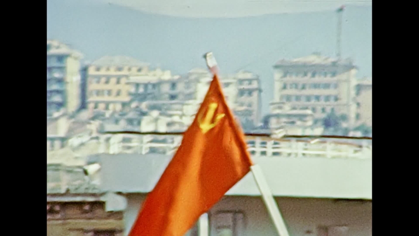 Russian cruise ship with the flag of the Soviet Union in the city port of Genova town in 1981. Archival of Italy in the 1980s with Genova city Italian harbor. | Shutterstock HD Video #1071837109