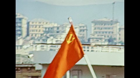 Russian cruise ship with the flag of the Soviet Union in the city port of Genova town in 1981. Archival of Italy in the 1980s with Genova city Italian harbor.