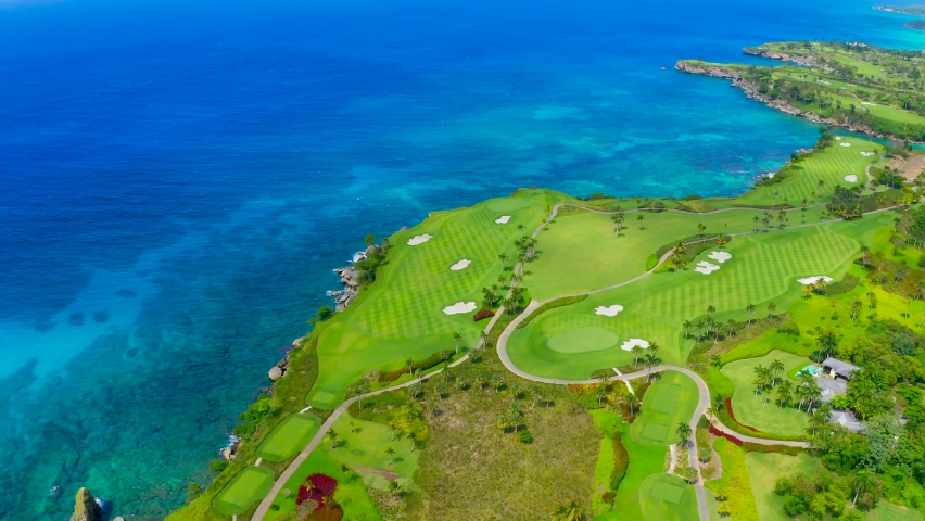 The tropical resort for sports tourism. of the Dominican Republic. Beautiful green golf courses on the shores of the blue Caribbean Sea. Aerial view of the planet Earth.
