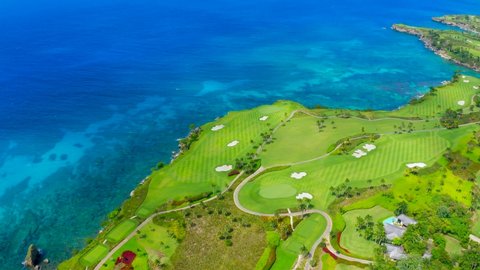 The tropical resort for sports tourism. of the Dominican Republic. Beautiful green golf courses on the shores of the blue Caribbean Sea. Aerial view of the planet Earth.