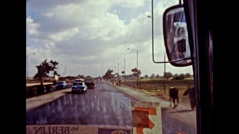 Alexandria, EGYPT, AFRICA - circa 1981: touristic tour by bus from Alexandria to Cairo city. Vintage cars in traffic on the highway. Historical archival of Egypt in the 1980s.