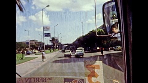 Alexandria, EGYPT, AFRICA - circa 1981: touristic tour by bus on the street of the Alexandria. Vintage cars in traffic of the city. Historical archival of Egypt in the 1980s.