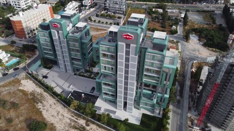 Limassol, Cyprus - 05 03 2021: Modern design residential twin  buildings in Limassol. Drone aerial 4k