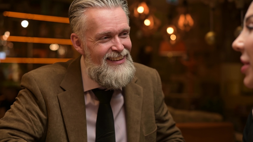 Male interlocutor listens attentively to his girlfriend during a conversation