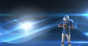 Animation of excited american football player holding ball on dark background with moving lights. pro sports template concept with copy space, digitally generated video.