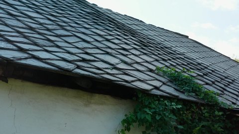 Building With Roof Made Of Cut Stones, Shaped And Positioned In A Geometric Way For Covering Roofs In Rural Areas - aerial, close up