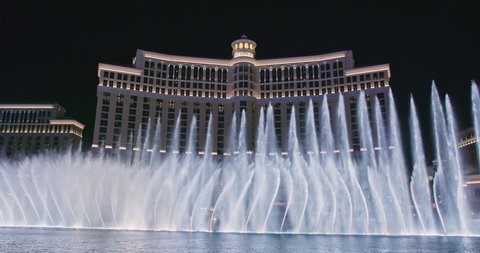 Las Vegas, Nevada, USA, March 2021. Water and light show in night city. Bellagio fountains dancing at night. Capital of adult night shows, casino and entertainment. 4K footage world famous Las Vegas