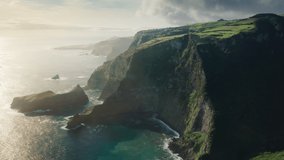 Amazing drone view of rocky mountains covered green fields of Casa do Gato Tomas, Flores Island, Azores, Portugal, Europe. Panoramic view of evergreen island in atlantic ocean, 4k footage 