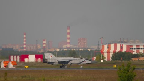 NOVOSIBIRSK, RUSSIAN FEDERATION - JUNE 17, 2020: Military aircraft all-weather fighter MiG-31 with drag parashute. Military supersonic interceptor aircraft the MIG-31 (Foxhound). Russian Air Force