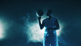 Male player is spinning a basketball on his finger - Powered by Shutterstock - Get 15% off with code: PIKWIZARD15