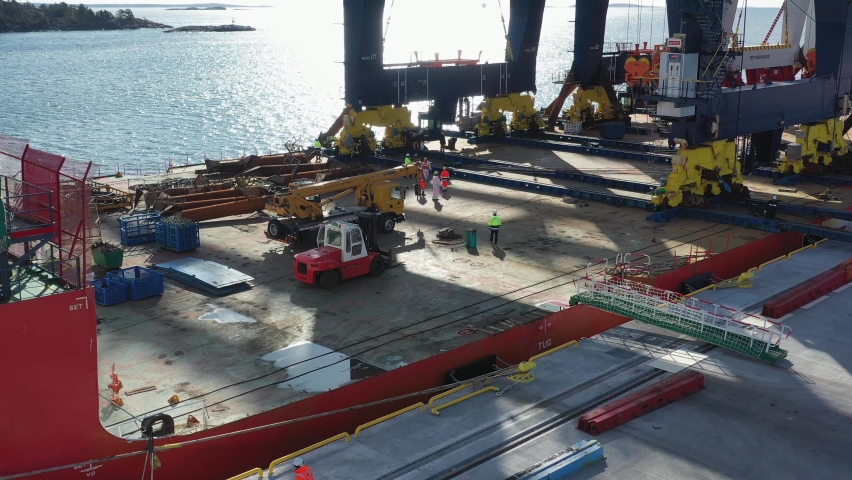 Stockholm Norvik Port, Sweden, 2020-03-18: Aerial view of installing new cranes, shipped from China to Sweden. High quality photo