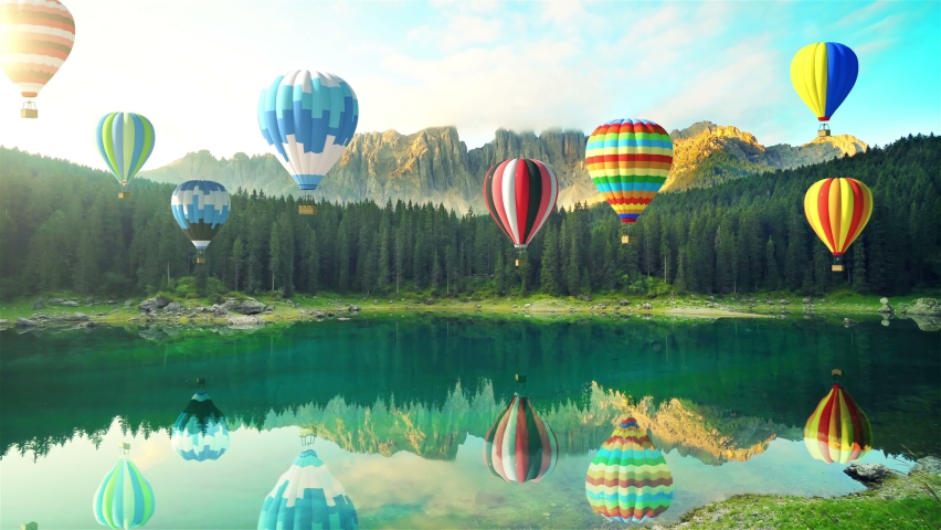 Group of Hot Air Balloons in the Air fly over Lake Carezzo in the Dolomites Alps. Mixed Media 4K Clip