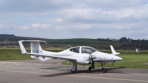 Shoreham, West Sussex, UK, April 16, 2021. Footage of a Twin Engine Diamond DA-42 Twin Star on the Taxiway at Brighton City Airport.