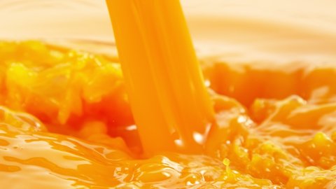 Super Slow Motion Shot of Pouring Fresh Orange Juice at 1000fps.