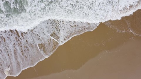 Aerial Drone Top Down View - Waves Crashing in a Beach with Golden Sand - Aveiro, Portugal