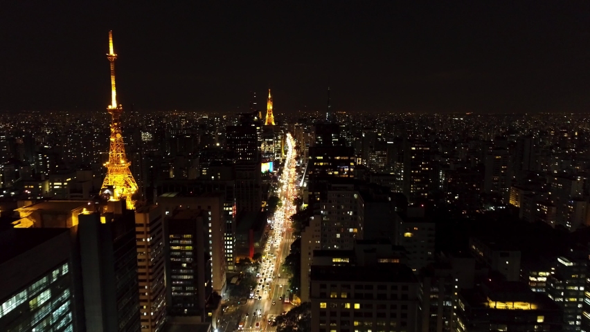 Sao Paulo, Brazil. Night panorama view of landmark of downtown city. Sao Paulo, Brazil. Famous Paulista avenue illuminated. Sao Paulo, Brazil. Antennas at skyline. Paulita Avenue, Sao Paulo. 