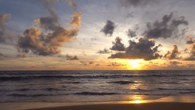 Professional video sunset tropical beach sea. New normal after covid-19. Phuket Thailand beautiful tropical beach with a sunset sky. Beautiful Phuket beach is a famous tourist destination Andaman sea
