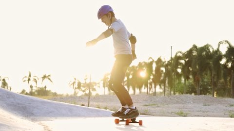 Happy asian teen boy exercise surf skate at parking in her house, outdoor sport lifestyle of new normal ,In the moment Virus outbreak. Slow motion . Stock Video