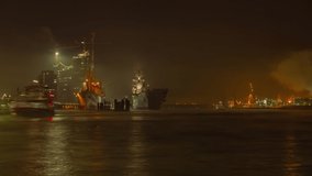 extraordinary long exposure time lapse shot of the port of Hamburg with an aircraft carrier on the bank with spectacular fog and many boats - Powered by Shutterstock - Get 15% off with code: PIKWIZARD15