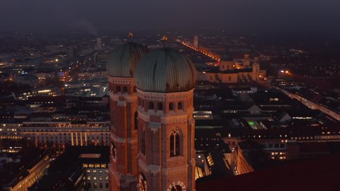 Scenic Close up Shot of Two Church Towers of Frauenkirche Church Cathedral in Munich, Germany from an Aerial Drone Perspective, Establishing Shot