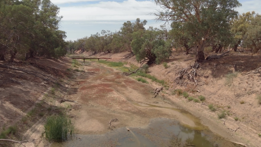 Dry Australian River in Drought Conditions due to global warming and climate change. Aerial Drone View of Dry river bed (Darling River, New South Wales) | Shutterstock HD Video #1071945727