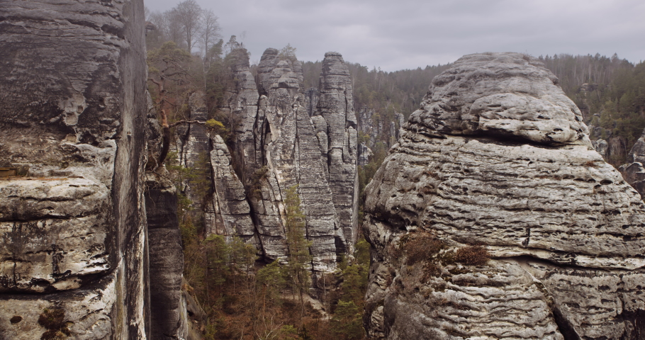 Saxon Switzerland, a hilly national park with rock formations inside fir tree forest