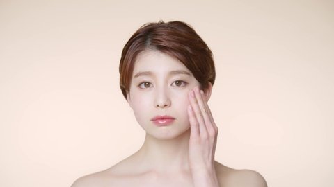 Young asian woman Worrying about her facial skin. Skin care. Acne care.