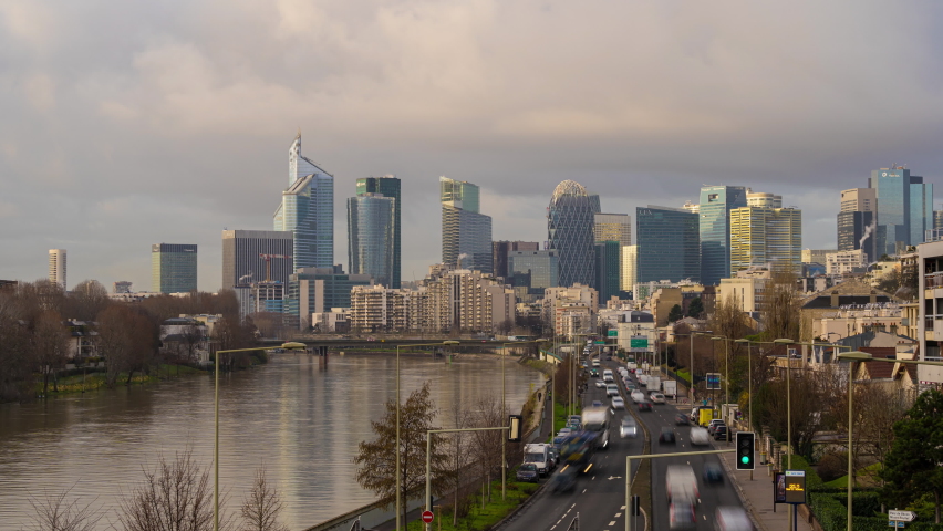 Timelapse Sunny Sky and Clouds in Movement at Day on La Defense Business District with Traffic Royalty-Free Stock Footage #1071969109