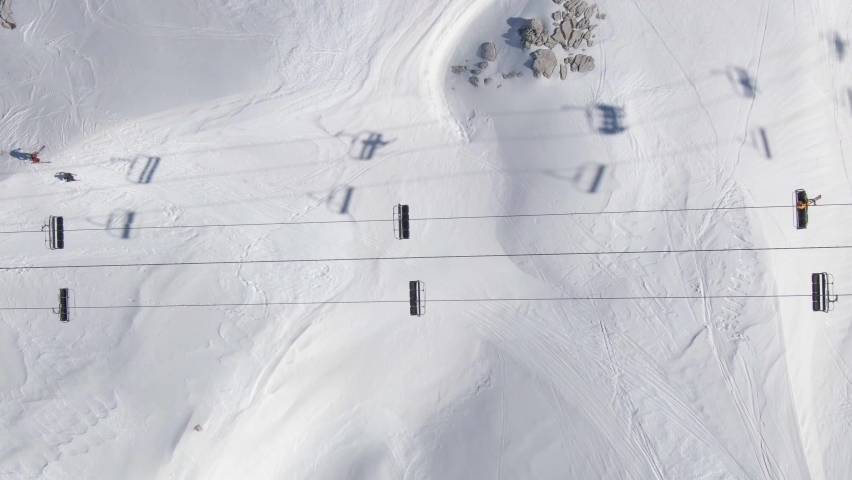 Chairlift and Ski Slope From Above. High quality video footage