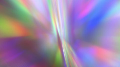 A beam of iridescent rainbow neon purple and bright acid rays of light through a prism. Chromatic aberration. Abstract blurred multicolored background